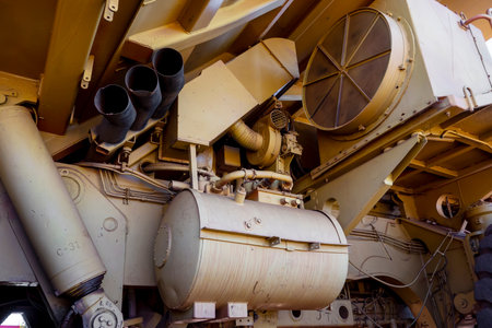 NEWMAN, WESTERN AUSTRALIA - JULY 11, 2018: Detail of shock-absorber, fan and exhaust of yellow Wabco Haulpak truck in Newman, Western Australiaのeditorial素材