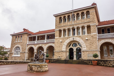 PERTH, WESTERN AUSTRALIA - JULY 16, 2018: Building of Perth Mint museum with a statue in front of itのeditorial素材