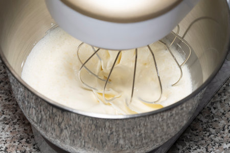 The process of whipping of batter in a planetary mixer. Selective focus.の写真素材