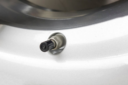 A fragment of the wheel of the car with the nipple.の写真素材
