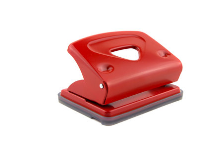 Red office paper hole puncher, isolated on white backgroundの写真素材