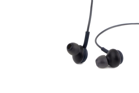 Black earphones. Isolated on white background.の写真素材