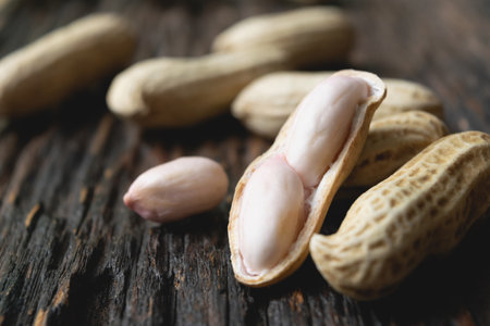 close- up from natural peanut on dark wooden this concept is for agriculture or health.