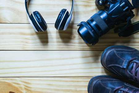 Top view shoes,camera ,map on wooden in travel concept.の写真素材