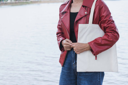 woman carry bag on nature background in save earth concept or say no plastic bag.の写真素材