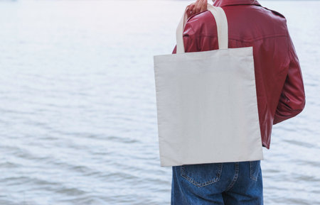 woman carry bag on nature background in save earth concept or say no plastic bag.の写真素材