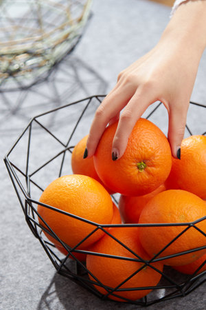 Oranges in a fruit basketの写真素材