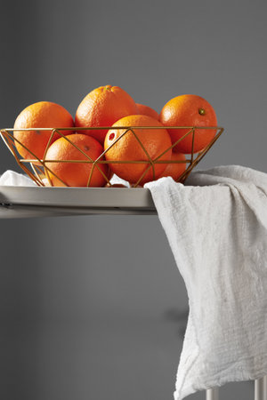 Oranges in a fruit basketの写真素材