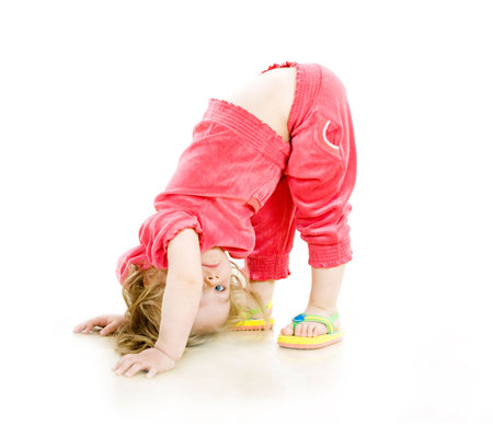 Pretty little girl makes some exercisesの写真素材