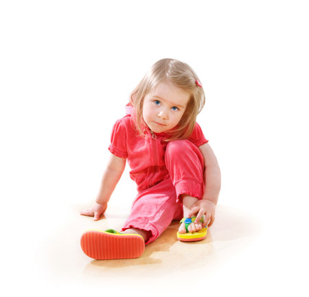 Closeup portrait of a little serious girl の写真素材