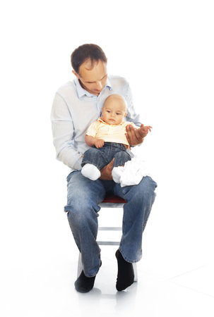 Daddy with his unhappy baby isolatedの写真素材