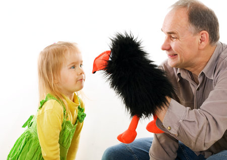 Man playing with little girlの写真素材