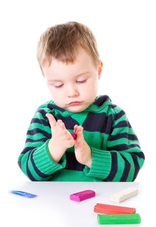 Little boy with plasticineの写真素材