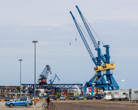 Rostock, Germany - May 30 2019: Two blue cranes with yellow details in the harbour of the hansa stadt Rostock, on the northern coast of Germany.のeditorial素材