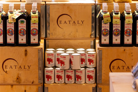 Stockholm, Sweden - July 15 2019: Some bottles of olive oil and some cans with tomatoes in the Italian brand store Eataly in Stockholm, Sweden.のeditorial素材