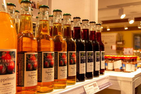 Stockholm, Sweden - July 15 2019: Some glass bottles of fresh apple juice from the Swedish company "VÃ¤rmdÃ¶ Musteri" in an Eataly store in Stockholm, Sweden.のeditorial素材