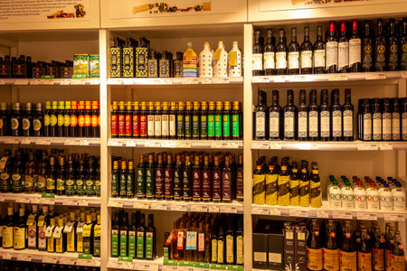 Stockholm, Sweden - July 15, 2019: Some shelves with different brands of olive oil in an Eataly store in Stockholm Sweden.のeditorial素材