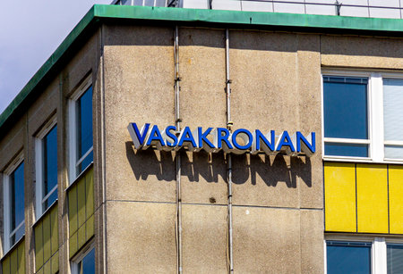 MalmÃ¶, Sweden - July 20 2019: A lit sign with the name of the Swedish real estate company Vasakronan mounted on an office building in downtown MalmÃ¶, Sweden.のeditorial素材