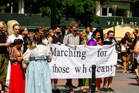 MalmÃ¶, Sweden - July 20, 2019: A group of young people with taped mouths, demonstrating in the pride parade for the people that cannot march themselves.のeditorial素材