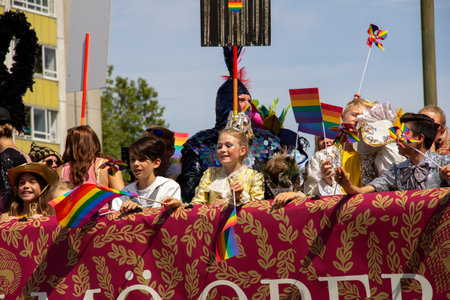 MalmÃ¶, Sweden - July 20, 2019: A young girl dressed up as a fairytale princess is looking down on the crowds as the float goes by during the annual pride parade in MalmÃ¶, Sweden.のeditorial素材