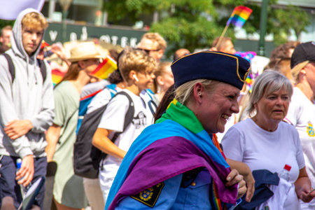 Police woman laughing while participating in pride parade in MalmÃ¶, Swedenのeditorial素材