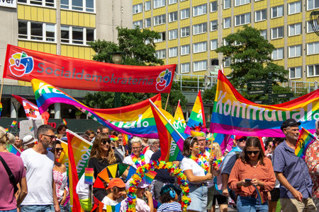MalmÃ¶, Sweden - July 20, 2019: The Swedish Social Democrats are participating in the annual gay pride parade in MalmÃ¶, waving their red banners.のeditorial素材
