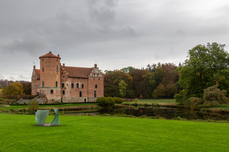 Torup, Sweden - October 20, 2019: The green grass in front of Torup castle is well maintained. A piece of art has been placed on the grass as well.のeditorial素材