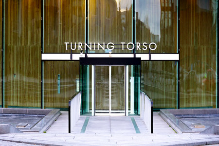 MalmÃ¶, Sweden - November 25, 2018: The strict, ultra modern, glass facade and entrance to Turning Torso, the tallest building in Sweden, designed by Santiago Calatrava.のeditorial素材