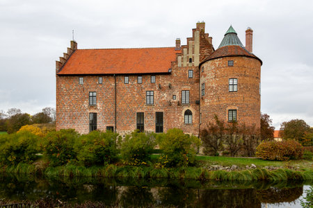 Torup, Sweden - October 20, 2019: The back facade of the old red brick castle Torup that stands in the forest outside MalmÃ¶, Swedenのeditorial素材
