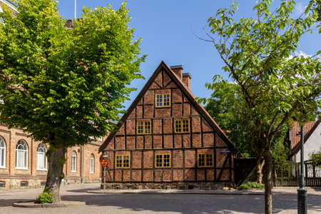 Lund, Sweden - June 24, 2018: An old half timbered house on a cobble stoned street in the old parts of the university town of Lundのeditorial素材