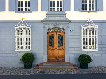 Bern, Schweiz - July 17, 2017: A grand entrance with wooden doors in old style to the building Augustiner Hof in Bernのeditorial素材