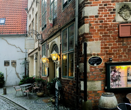 Bremen, Germany - July 28, 2017: The entrance to a restaurant in a rustic old brick building in the old parts of Bremen called Schnoor.のeditorial素材