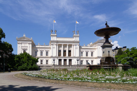 Fountain and flowers in front of the main university building in Lund, Swedenのeditorial素材
