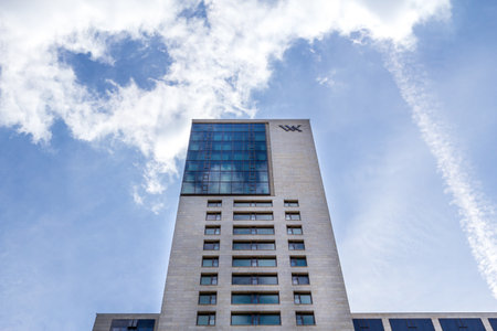 Berlin, Germany - May 30, 2019: The skyscraper Zoofenster is rising towards the blue sky. The emblem of Waldorf Astoria is mounted on the facade as it houses a hotel.のeditorial素材