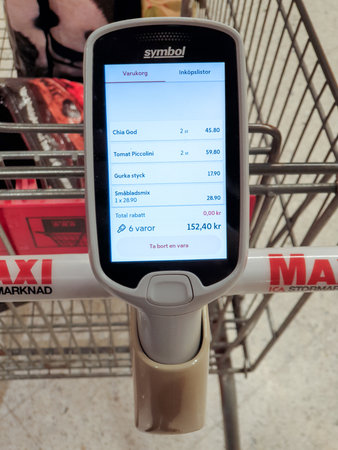 MalmÃ¶, Sweden - February 1, 2020: The grocery store ICA Maxi has updated the firmware of the hand scanner that people use to shop fasterのeditorial素材