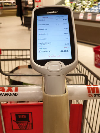 MalmÃ¶, Sweden - February 1, 2020: The grocery store ICA Maxi has updated the firmware of the hand scanner that people use to shop fasterのeditorial素材