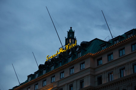Stockholm, Sweden - July 14, 2019: The lit sign of Grand Hotel in Stockholm during a warm summer evening.のeditorial素材