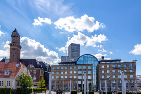 MalmÃ¶, Sweden - The new skyline with MalmÃ¶ Live seen behind an older office building on a bright summer dayのeditorial素材