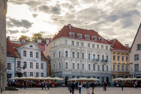 Tallinn, Estonia - July 7, 2019: The famous old town square in the UNESCO world heritage protected old town is bordered with beautiful buildings and tourists strollingのeditorial素材