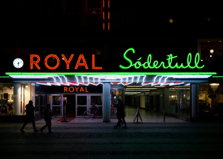 MalmÃ¶, Sweden - December 1, 2019: People are walking by the neon sign decorated entrance to the cinema Royal owned by the movie company Filmstadenのeditorial素材