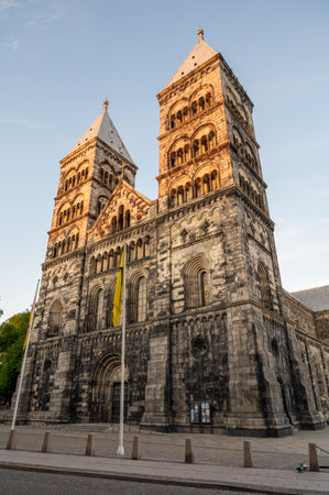 Hero shot of the facade and steeples of Lund cathedral during sunset on a warm summer evening
