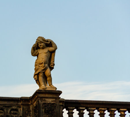 A sculpture placed on a balcony railing in a public park in Dresden, Germanyのeditorial素材