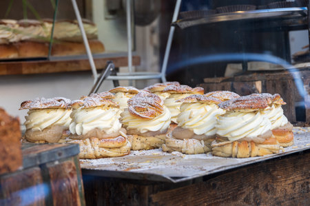 Semla made out of cardamom buns filled with whipped cream in a rustic way