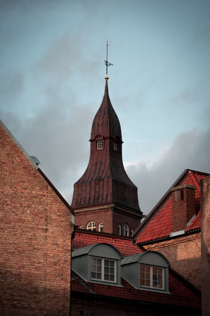 Roof tops and towers in autumn light in Lund Swedenの写真素材