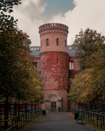 The medieval building Kungshuset (The Kings House) in the park LundagÃ¥rd in Lund Sweden during autumnのeditorial素材