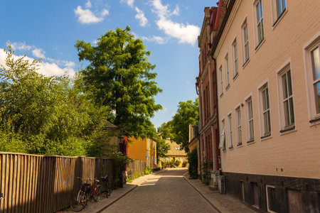 Narrow cobblestoned street in the old town of Lund Sweden in summertimeの写真素材