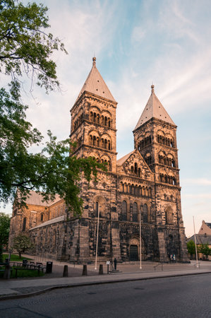 The medieval cathedral lit by the sunset in Lund Sweden during summerの写真素材