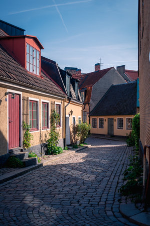Town houses along cobblestoned street in historic university town of Lund Swedenのeditorial素材