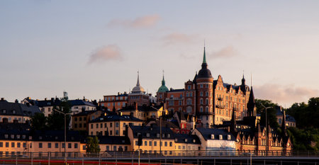 Stacked buildings on a hill in Stockholm Sweden during sunsetの写真素材