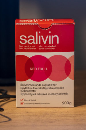 Lund, Sweden - February 5, 2022: A red and white package with Swedish text of medical product Salivin for dry mouthのeditorial素材